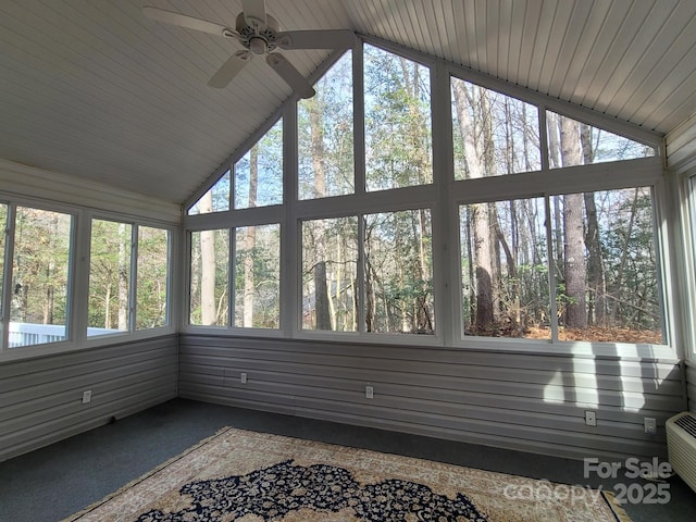 sunroom with lofted ceiling, a wealth of natural light, and ceiling fan