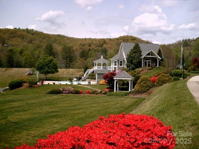 view of property's community featuring a gazebo and a yard