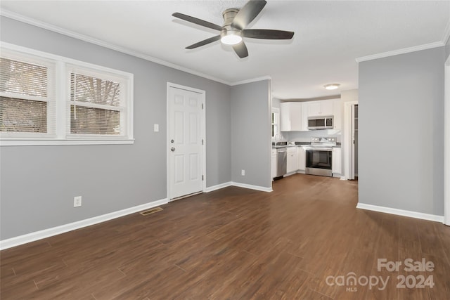 unfurnished living room with dark hardwood / wood-style flooring, ceiling fan, and ornamental molding