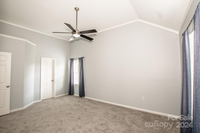 unfurnished bedroom with ceiling fan, light colored carpet, lofted ceiling, and crown molding