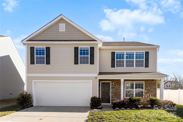 view of front facade featuring a garage and a front yard