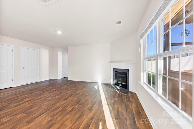 unfurnished living room with dark hardwood / wood-style floors