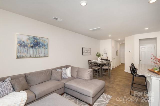 living room with dark hardwood / wood-style floors