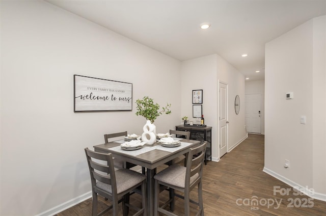 dining space featuring dark hardwood / wood-style flooring