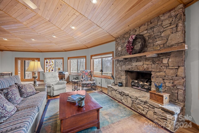 living room featuring a fireplace, wood ceiling, and dark hardwood / wood-style floors