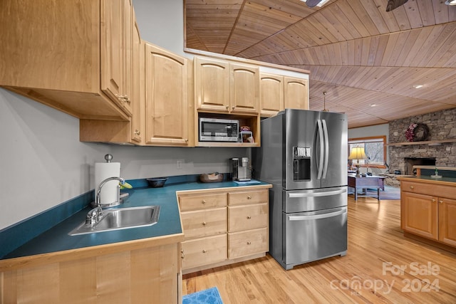 kitchen featuring light brown cabinets, sink, appliances with stainless steel finishes, and light hardwood / wood-style flooring