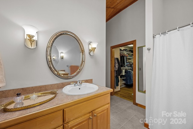 bathroom featuring tile patterned flooring, a shower with curtain, vanity, and wood ceiling