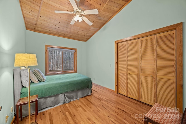 bedroom with hardwood / wood-style flooring, ceiling fan, wooden ceiling, and vaulted ceiling