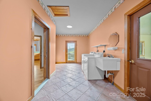 417 Quiet Forest Ln, Sylva, NC 28779 - laundry area featuring separate washer and dryer, laundry area, a sink, and baseboards