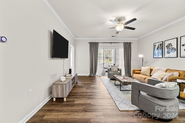 living room with dark hardwood / wood-style flooring, ceiling fan, and ornamental molding