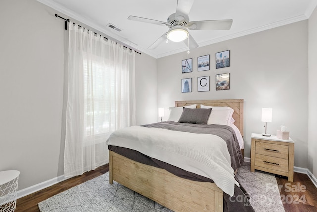 bedroom with ceiling fan, dark hardwood / wood-style flooring, and ornamental molding