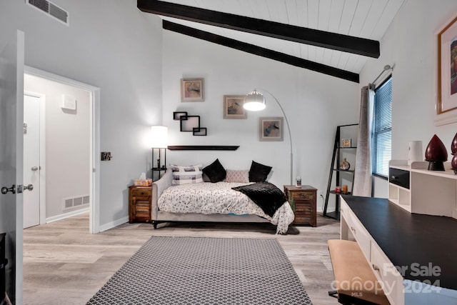 bedroom featuring beamed ceiling, light hardwood / wood-style floors, and high vaulted ceiling