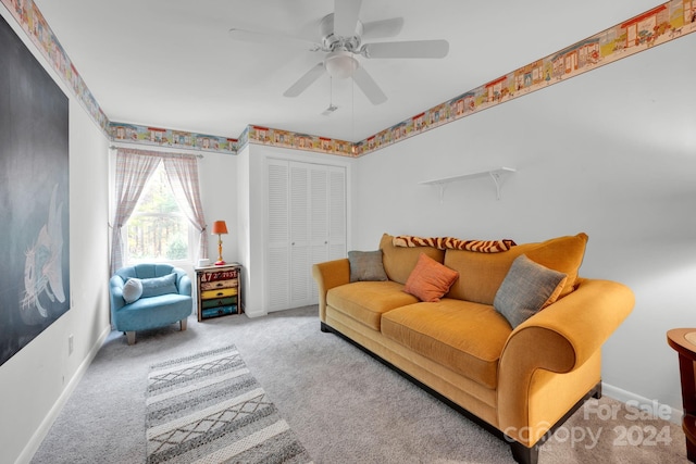 carpeted living room with ceiling fan