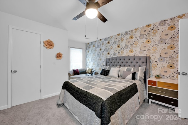 carpeted bedroom featuring ceiling fan