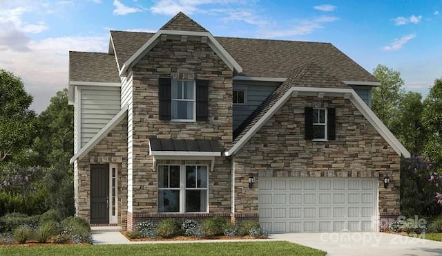 view of front of property featuring a garage and a front lawn