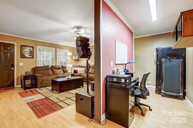 living room featuring ornamental molding, ceiling fan, and light hardwood / wood-style flooring