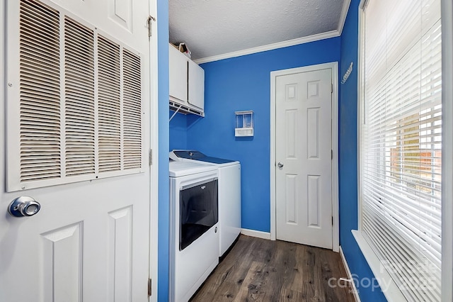 laundry room featuring dark hardwood / wood-style floors, separate washer and dryer, cabinets, ornamental molding, and a textured ceiling