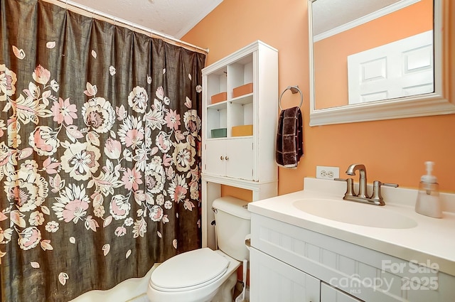 bathroom with vanity, ornamental molding, a textured ceiling, and toilet