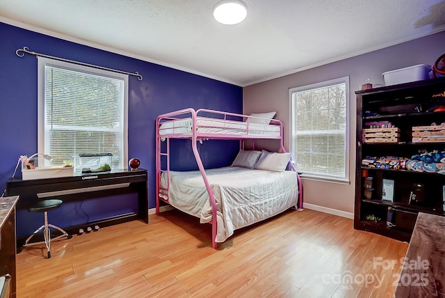 bedroom featuring hardwood / wood-style flooring and a textured ceiling