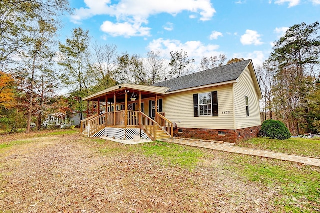 back of house with covered porch