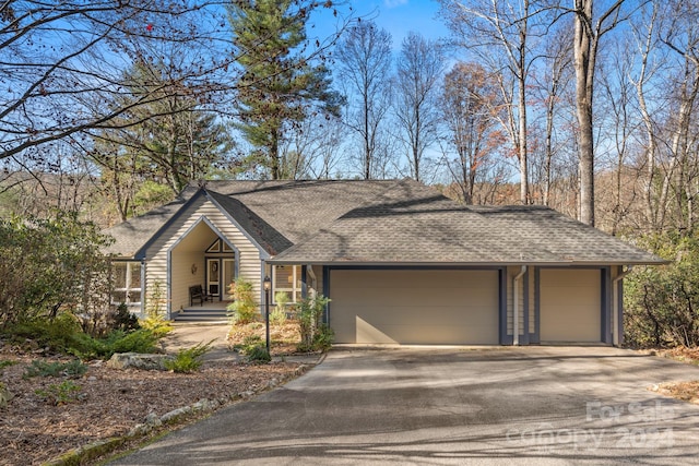 ranch-style house featuring a garage