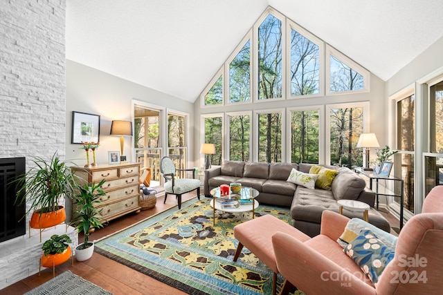 sunroom / solarium featuring vaulted ceiling and a wealth of natural light