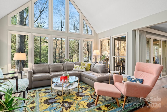 sunroom featuring lofted ceiling and a wealth of natural light