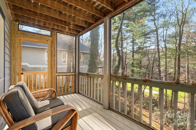 sunroom / solarium with beam ceiling and wood ceiling