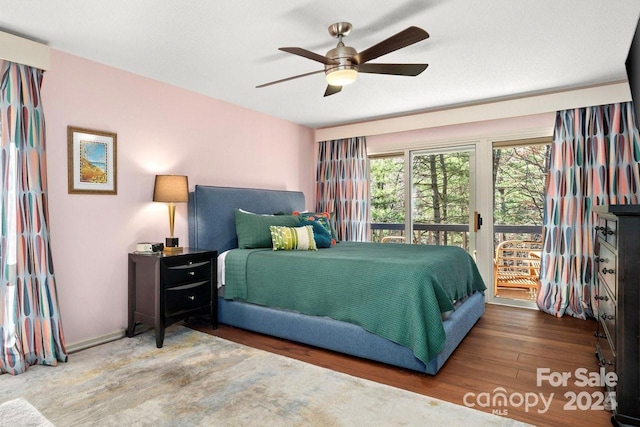 bedroom with hardwood / wood-style flooring, ceiling fan, and access to exterior