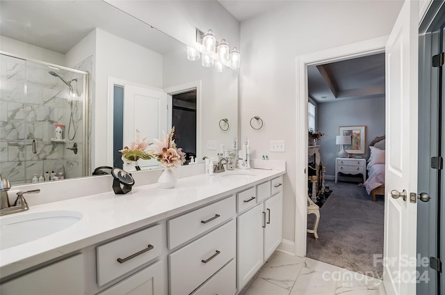 bathroom featuring vanity and a shower with shower door