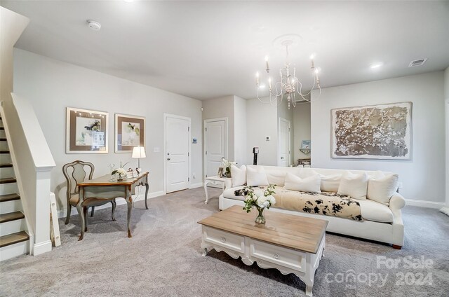 living room featuring light carpet and a notable chandelier