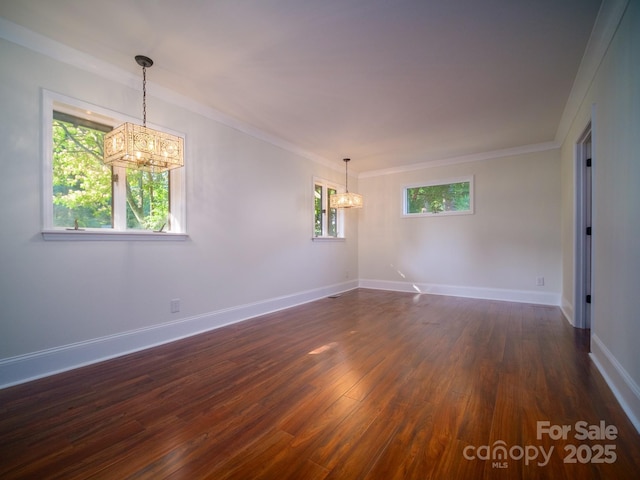 unfurnished room with a chandelier, dark wood-style flooring, and baseboards