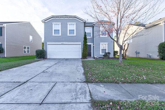 front of property featuring a garage and a front lawn