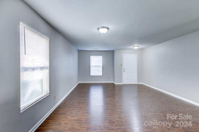 spare room featuring dark hardwood / wood-style floors