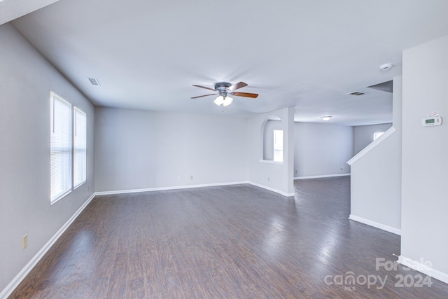 unfurnished room featuring dark hardwood / wood-style floors and ceiling fan