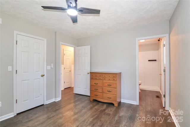 bedroom featuring ceiling fan, connected bathroom, a textured ceiling, and dark hardwood / wood-style flooring