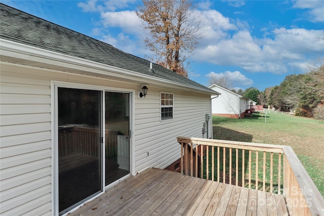 wooden deck with a yard