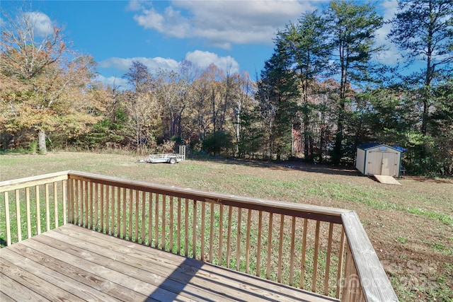 deck featuring a yard and a storage shed