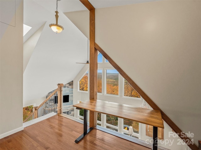 bonus room featuring high vaulted ceiling and hardwood / wood-style flooring