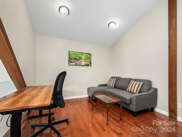 office featuring hardwood / wood-style flooring and lofted ceiling