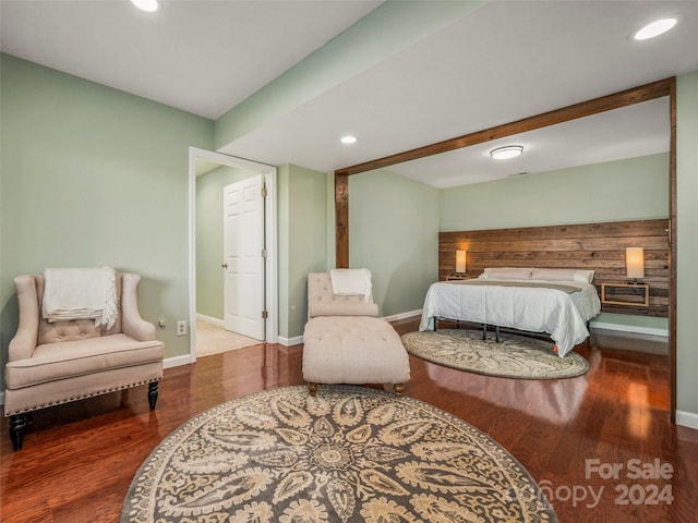 bedroom with hardwood / wood-style flooring