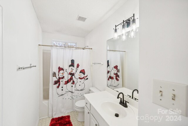 full bathroom with shower / bath combination with curtain, toilet, and vanity