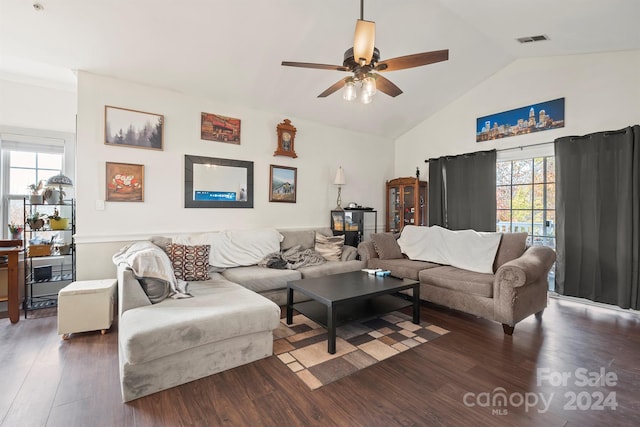 living room featuring dark hardwood / wood-style floors, a wealth of natural light, lofted ceiling, and ceiling fan