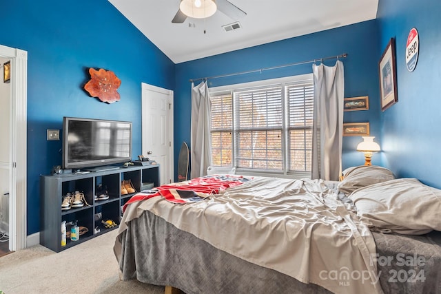 bedroom with carpet, vaulted ceiling, and ceiling fan