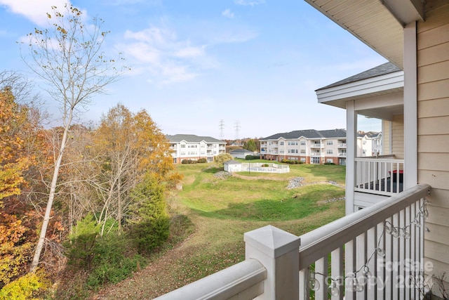 view of yard featuring a balcony