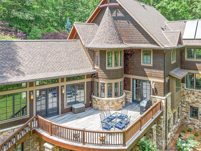 wooden deck featuring area for grilling