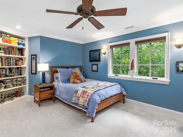 bedroom with ceiling fan, carpet floors, and ornamental molding