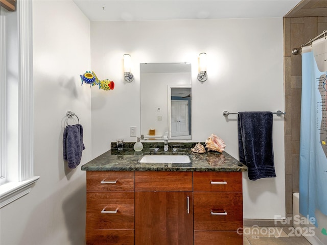 bathroom with tile patterned flooring and vanity