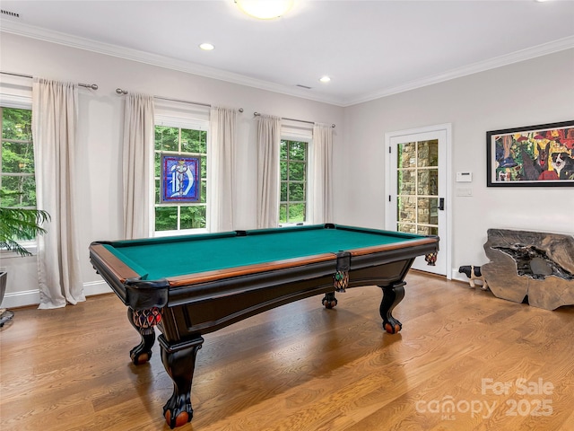 game room with pool table, ornamental molding, and light wood-type flooring