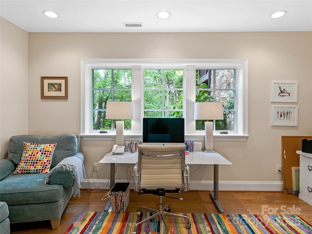 office space with hardwood / wood-style floors